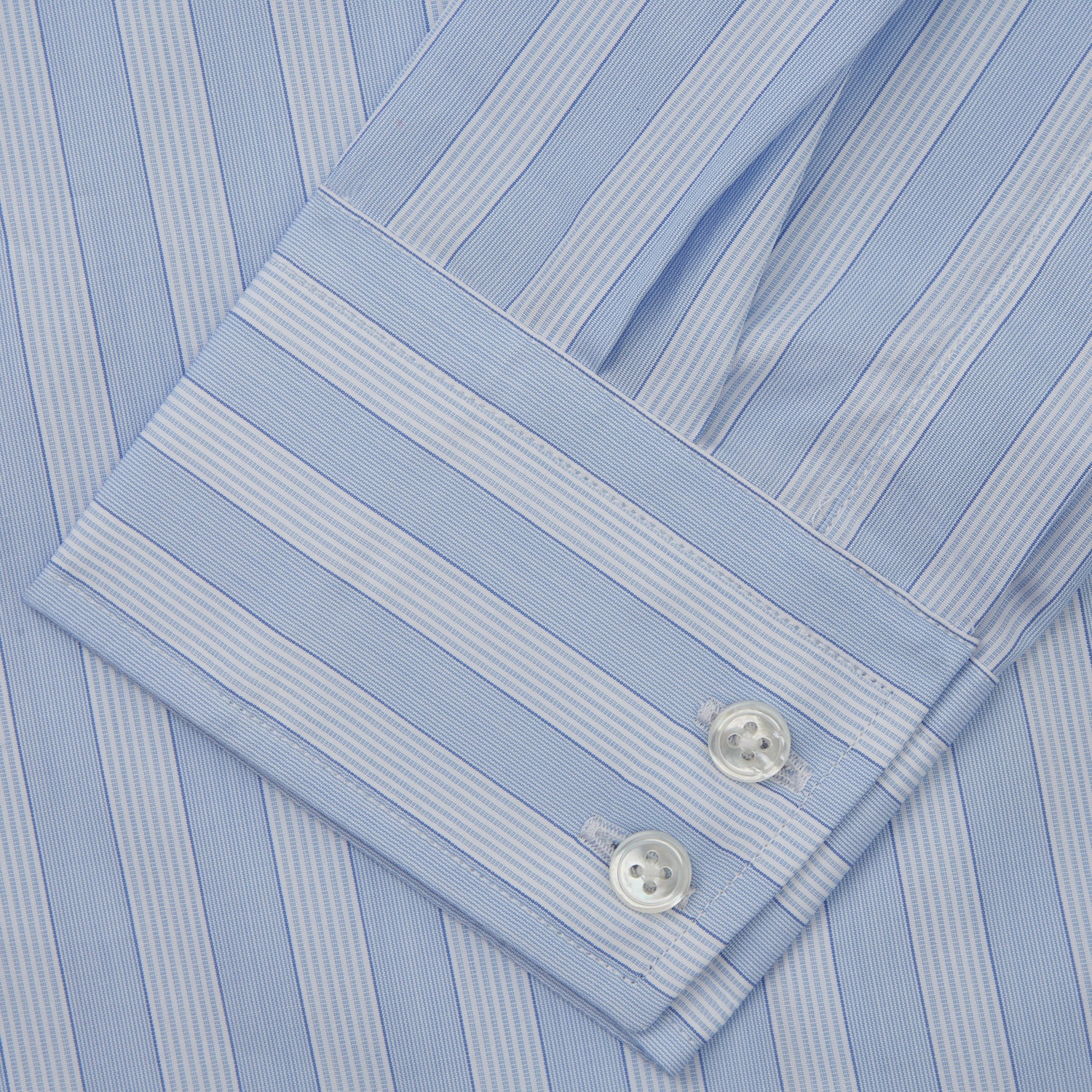 View 3 of product The Turnbull & Asser Tonal Blue Stripe Tailored Fit Shirt with Kent Collar features long sleeves and a button-up front, shown laid flat against a white background.