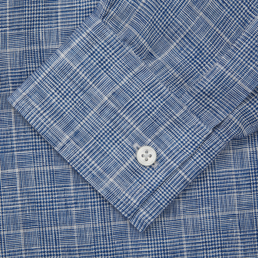 The Indigo Linen Glen Check Weekend Fit Shirt with Derby Collar by Turnbull & Asser is a light blue, long-sleeve checked linen shirt, featuring a subtle white plaid pattern and shown against a plain white background.