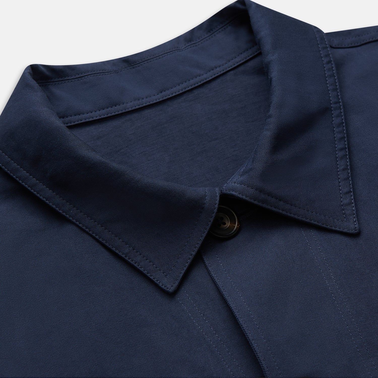 View 2 of product The Turnbull & Asser Navy Cotton-Linen Remy Chore Jacket features a collar, long sleeves, button closure, and three front pockets—a versatile minimalist essential for any men's wardrobe, shown laid flat on a white background.
