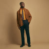 View 2 of product The Brown Ainsley Ribbed Shawl Cashmere Cardigan by Turnbull & Asser features a ribbed knit texture, black front buttons, and two front pockets, displayed laid flat on a white background.
