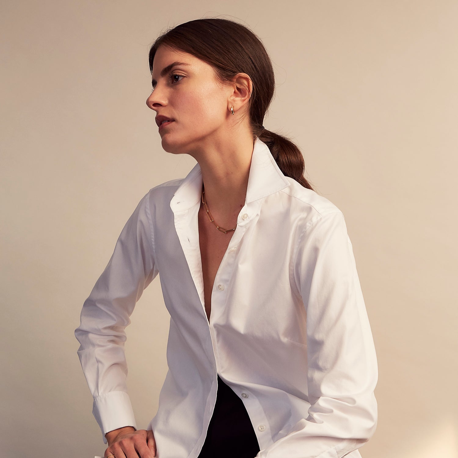 View 9 of product The Turnbull and The Deck White Cotton Traditionalist Shirt by Turnbull & Asser features a classic collar, buttoned front and cuffs, and a refined Royal Oxford weave, shown on a plain light gray background.