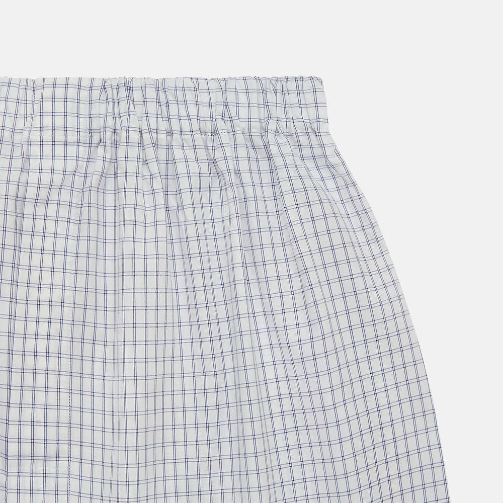 Turnbull & Asser White and Blue Check Cotton Godfrey Boxer Shorts: loose-fitting luxury cotton boxers with a blue check pattern and elastic waistband, shown on a plain white background.