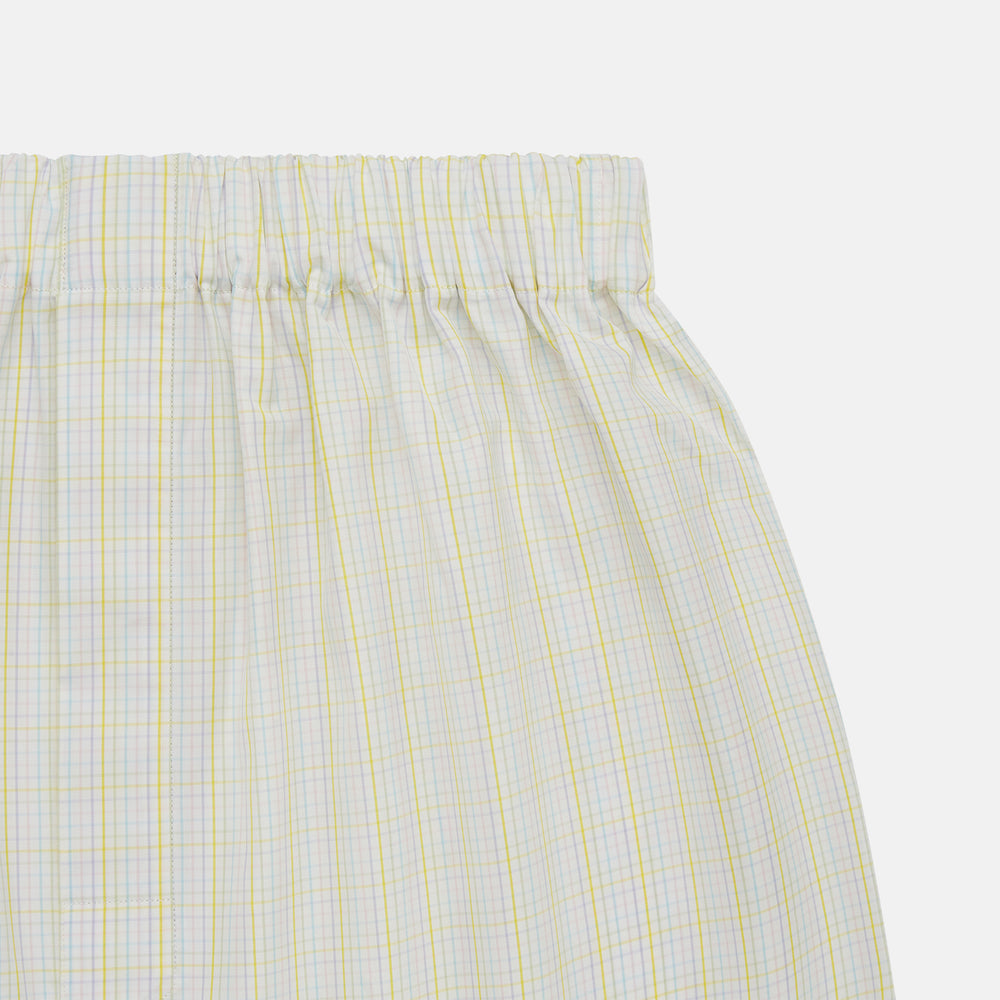 Turnbull & Asser Yellow Multi Check Godfrey Boxer Shorts, crafted from soft cotton with an elastic waistband, feature a loose fit and plaid design, shown on a plain white background.