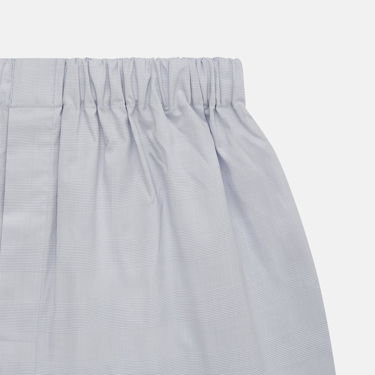 View 2 of product Faded Blue Block Check Cotton Godfrey Boxer Shorts by Turnbull & Asser, shown flat on a white background. These luxury boxers offer a relaxed fit and smooth, simple design with an elastic waistband and no visible buttons or patterns.