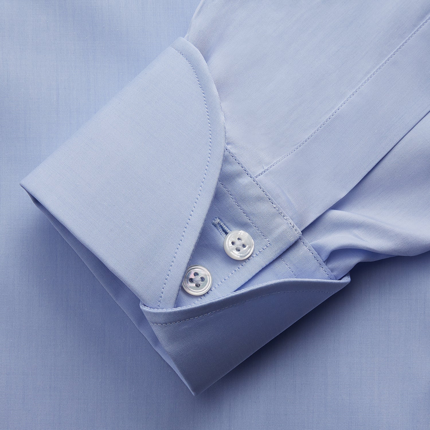 View 3 of product The Turnbull & Asser DR. NO Pale Blue West Indian Sea Island Cotton Shirt features a signature DR. NO collar and cuff, as seen on James Bond, and is displayed on a white background.