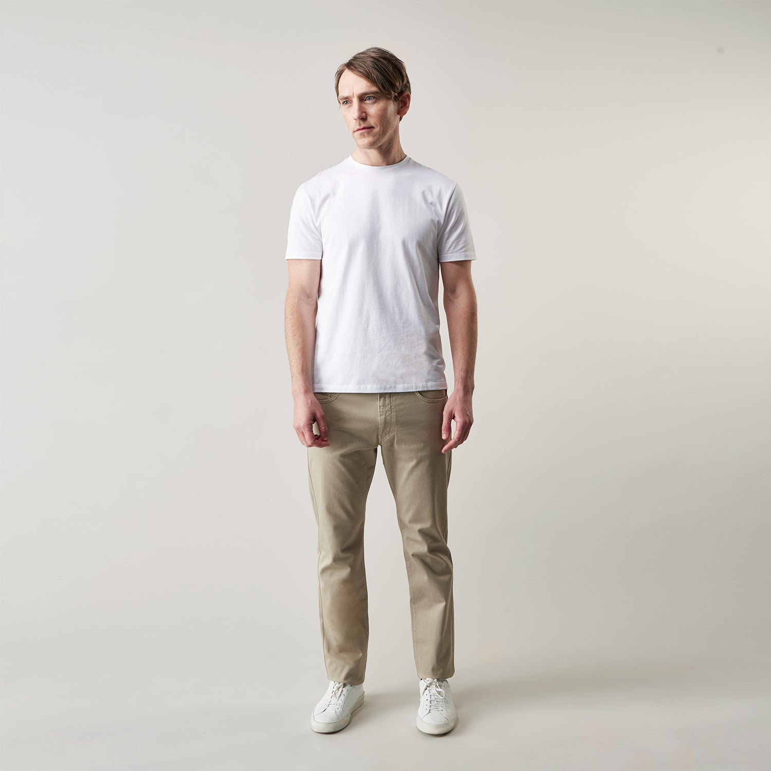 View 3 of product The Turnbull & Asser White Davey Cotton T-Shirt is shown on a white background. Crafted from fine-gauge jersey, it features short sleeves, a classic crew neck, and a clean front with no visible logos or designs.