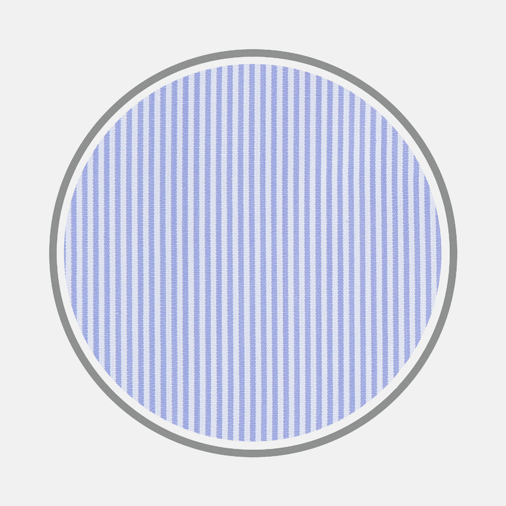 A circular swatch of Turnbull & Asser’s Blue Fine Bengal Stripe Sea Island Quality Cotton Fabric, featuring light blue and white vertical pinstripes and a gray border, is shown on a plain white background.