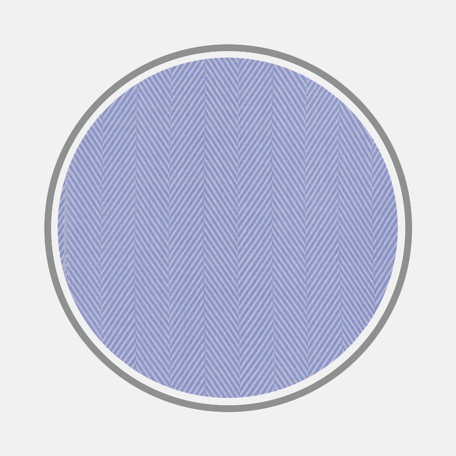 View 1 of product Turnbull & Asser's Blue Herringbone Sea Island Quality Cotton Fabric features thin light blue herringbone lines in a circular pattern on a darker blue background, encircled by gray and set against a plain light gray backdrop.