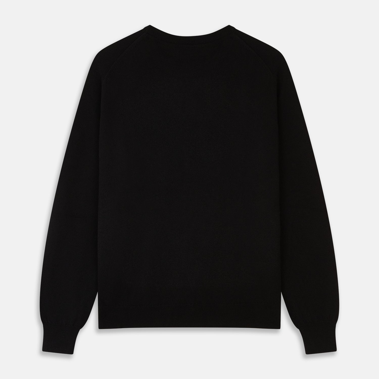 View 3 of product The Turnbull & Asser Black Crew Neck Cashmere Jumper is shown laid flat on a white background, featuring ribbed cuffs and hem with a small white label inside the collar.