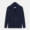 View 1 of product The Turnbull & Asser Navy Shawl Collar Cashmere Cardigan features a chunky knit, ribbed texture, button front, and two pockets—a luxurious piece laid flat on a white background for warmth and style.