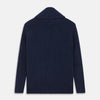 View 3 of product The Turnbull & Asser Navy Shawl Collar Cashmere Cardigan features a chunky knit, ribbed texture, button front, and two pockets—a luxurious piece laid flat on a white background for warmth and style.