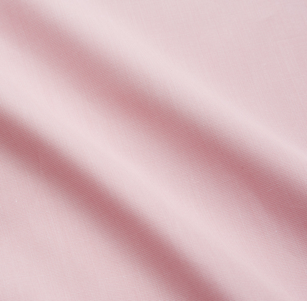 The Turnbull & Asser Pink Piped End-On-End Cotton Nightshirt features long sleeves, a pointed collar, button-down front, chest pocket, and a curved high-low hem for timeless, relaxed style.