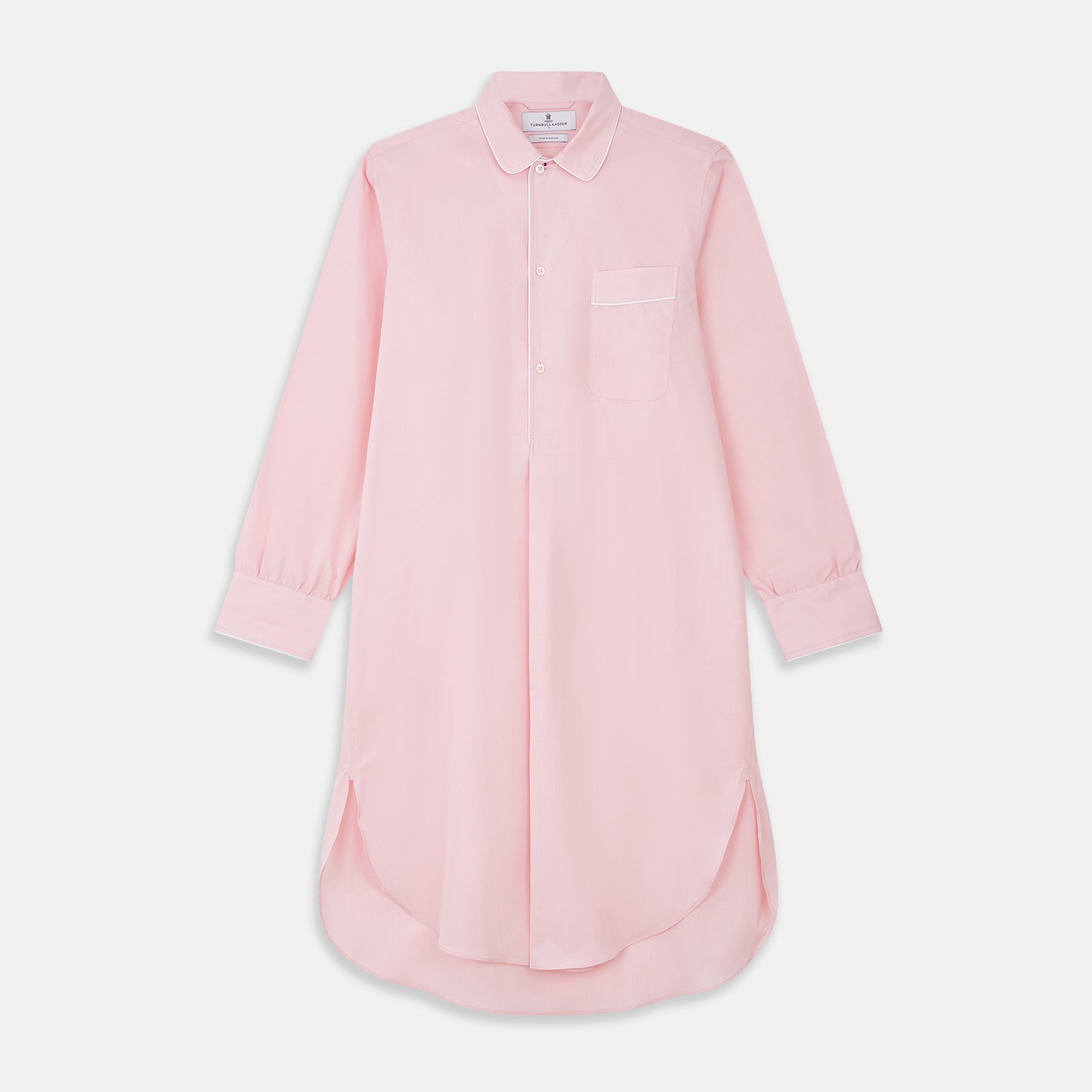 View 1 of product The Turnbull & Asser Pink Piped End-On-End Cotton Nightshirt features long sleeves, a pointed collar, button-down front, chest pocket, and a curved high-low hem for timeless, relaxed style.