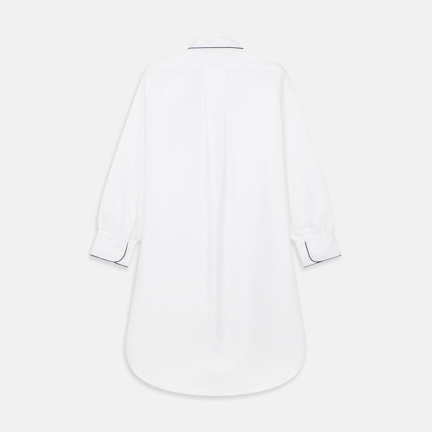View 5 of product The Turnbull & Asser White Piped Cotton Nightshirt features black piping on the collar, chest pocket, and cuffs, plus a curved hem and loose-fitting sleeves gathered at the wrists for a classic look.