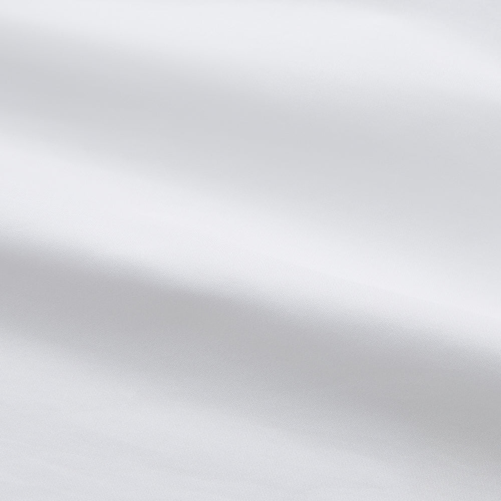 The Turnbull & Asser White Piped Cotton Nightshirt features black piping on the collar, chest pocket, and cuffs, plus a curved hem and loose-fitting sleeves gathered at the wrists for a classic look.