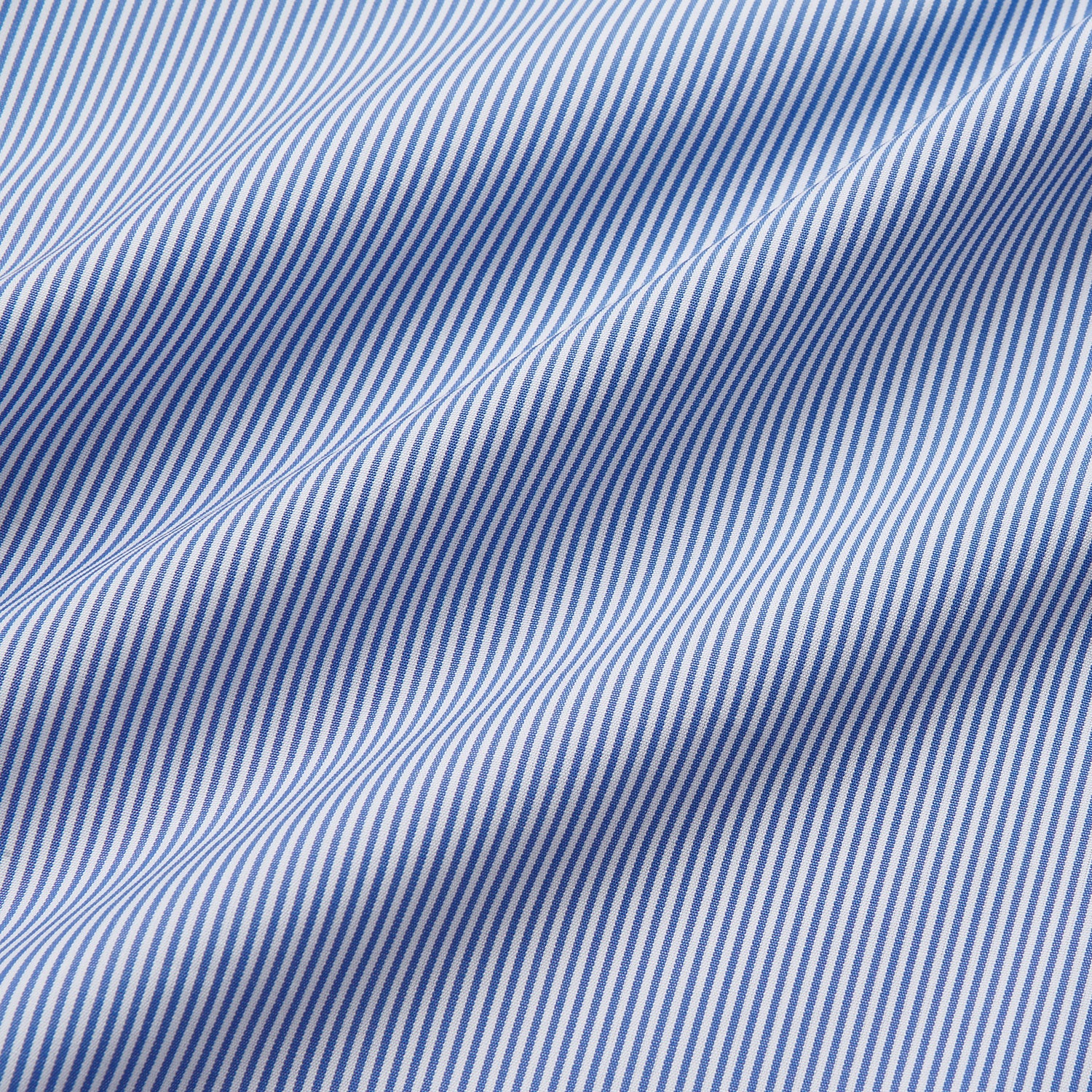 View 4 of product The Turnbull & Asser Blue Fine Bengal Stripe Piped Cotton Nightshirt features long sleeves, a chest pocket, black collar piping, curved hem, and side slits. It is displayed laid flat on a white background.