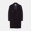 View 1 of product The Turnbull & Asser Navy Cashmere Joseph Overcoat features notched lapels, three front pockets, buttoned cuffs, and a hidden button closure—an essential men’s outerwear piece shown against a plain white background.