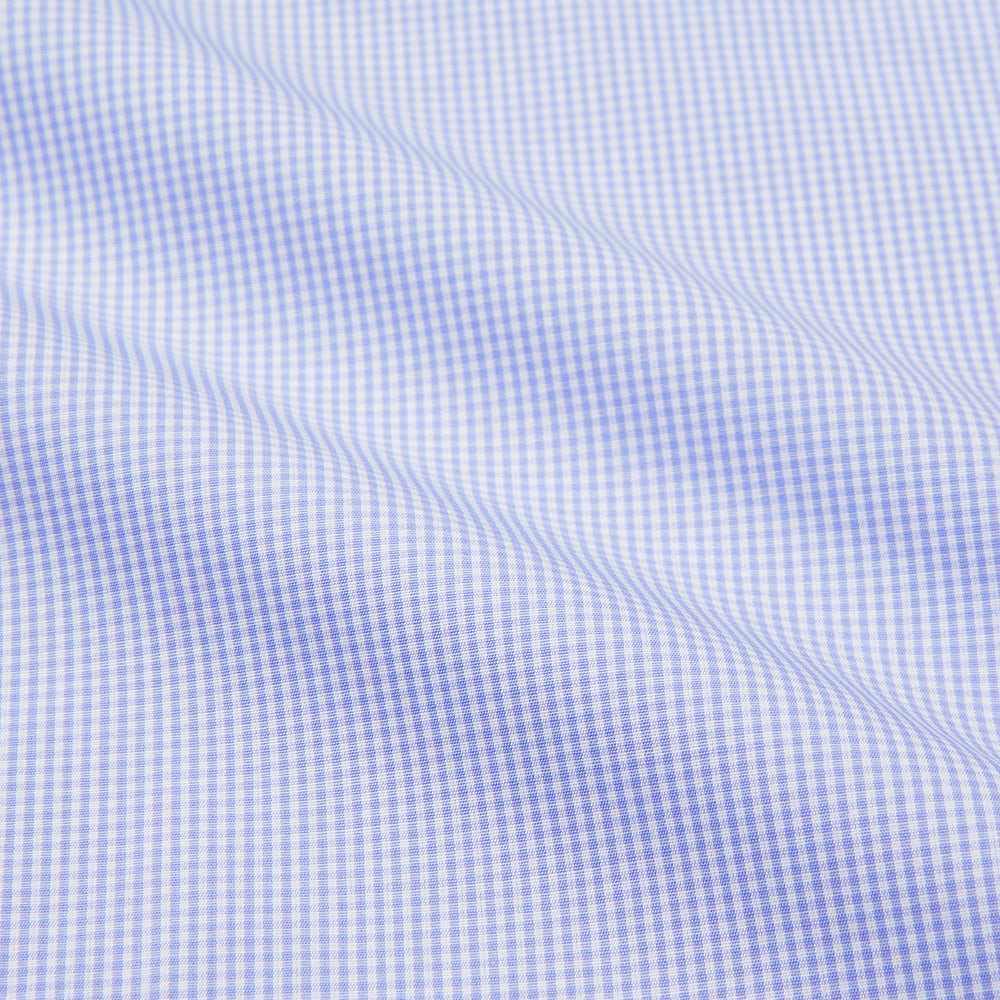 Turnbull & Asser's Blue Fine Check Piped Sea Island Quality Cotton Pyjama Set features white buttons, black piping on the collar, cuffs, and pocket, with matching drawstring pants—displayed flat on a white background.