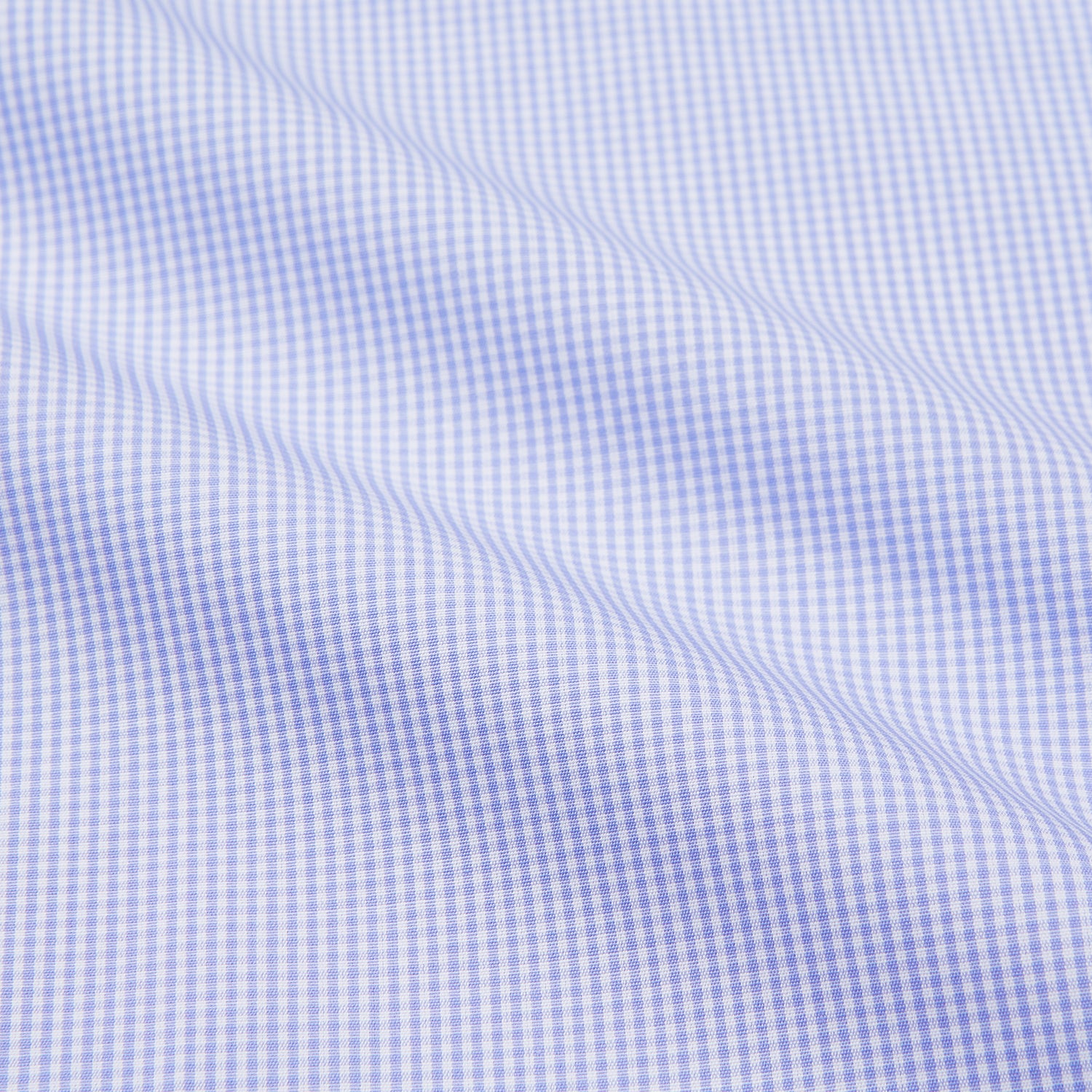 View 2 of product Turnbull & Asser's Blue Fine Check Piped Sea Island Quality Cotton Pyjama Set features white buttons, black piping on the collar, cuffs, and pocket, with matching drawstring pants—displayed flat on a white background.