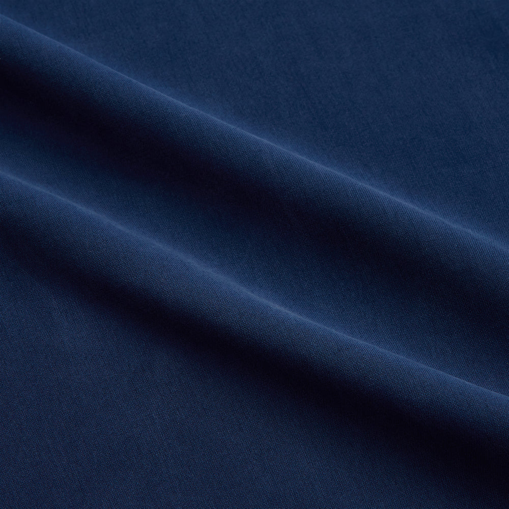 The Turnbull & Asser Navy Piped Silk Pyjama Set features a long-sleeve button-up top with a chest pocket and matching drawstring pants, laid flat on a white background for a luxurious look.