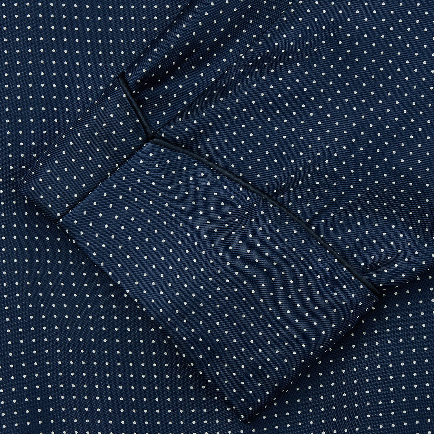 View 3 of product Experience luxurious nightwear with the Turnbull & Asser Navy Piped Silk Spot Gown, featuring elegant white dots for a timeless look.