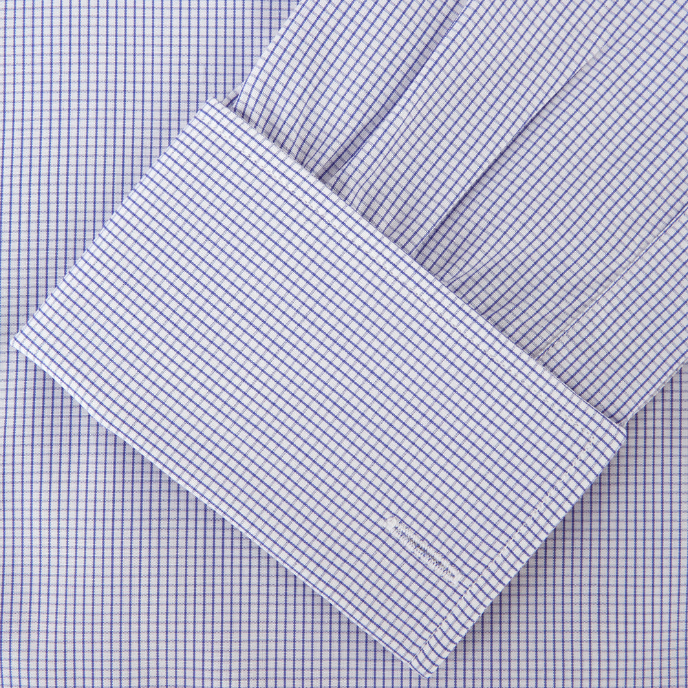 The Blue Grid Check Shirt by Turnbull & Asser features a T&A collar and double cuffs. This cotton long-sleeve shirt has an ultra-fine blue and white grid pattern and is displayed flat on a white background.