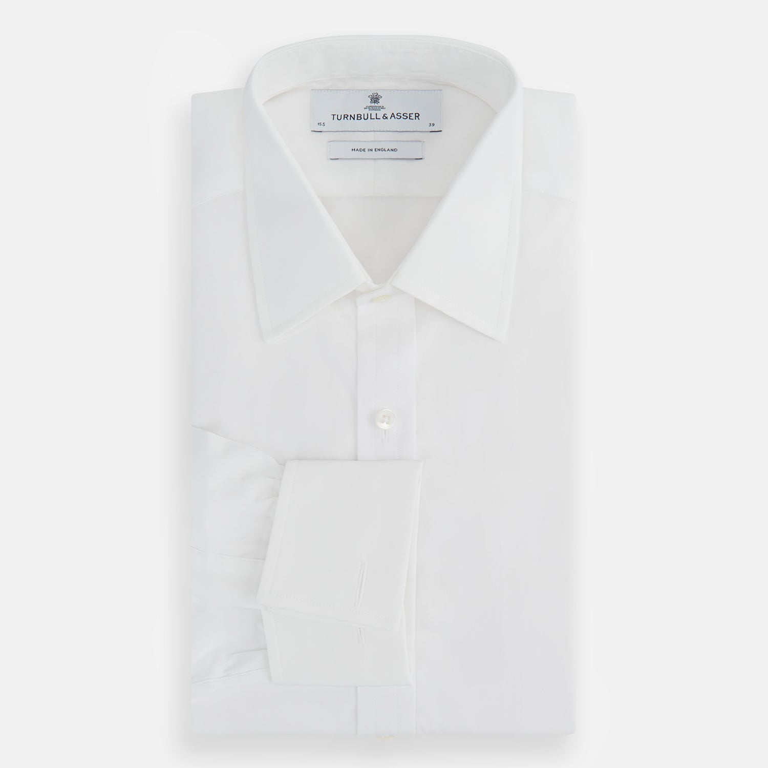 View 4 of product The Turnbull & Asser Plain White Cotton Shirt features a T&A collar, double cuffs, and a straight hem—ideal for minimalist style. Displayed on a plain white background.
