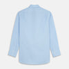 View 5 of product The Turnbull & Asser Pale Blue Organic Cotton Regular Fit Mayfair Shirt features long sleeves, a pointed collar, white buttons, and buttoned cuffs, shown laid flat on a white background.