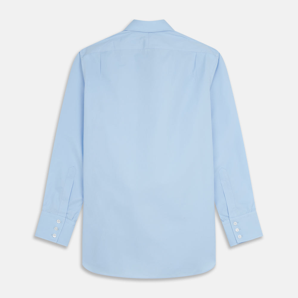 The Turnbull & Asser Pale Blue Organic Cotton Regular Fit Mayfair Shirt features long sleeves, a pointed collar, white buttons, and buttoned cuffs, shown laid flat on a white background.
