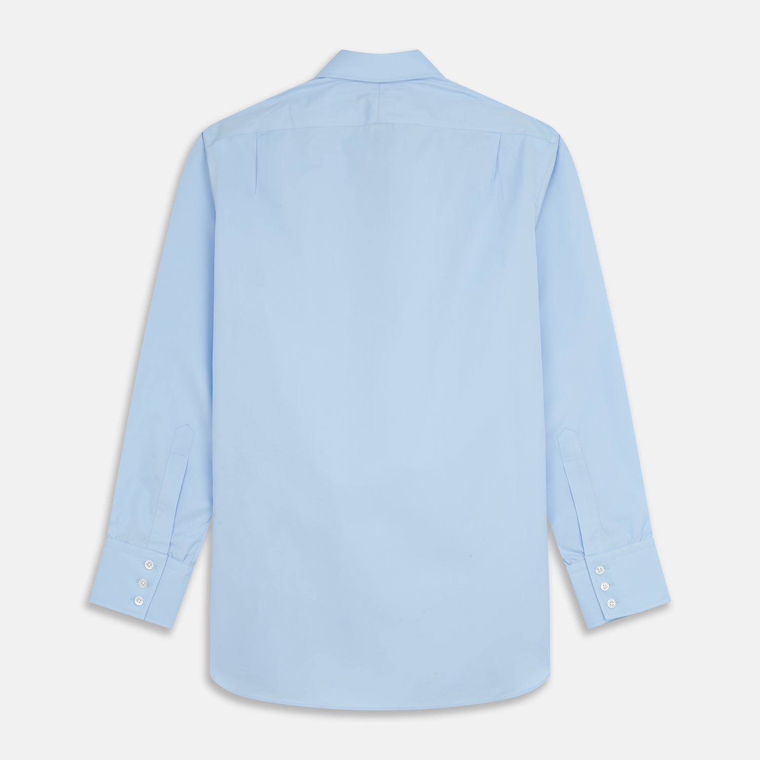 View 5 of product The Turnbull & Asser Pale Blue Organic Cotton Regular Fit Mayfair Shirt features long sleeves, a pointed collar, white buttons, and buttoned cuffs, shown laid flat on a white background.