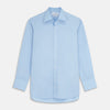View 1 of product The Turnbull & Asser Pale Blue Organic Cotton Regular Fit Mayfair Shirt features long sleeves, a pointed collar, white buttons, and buttoned cuffs, shown laid flat on a white background.