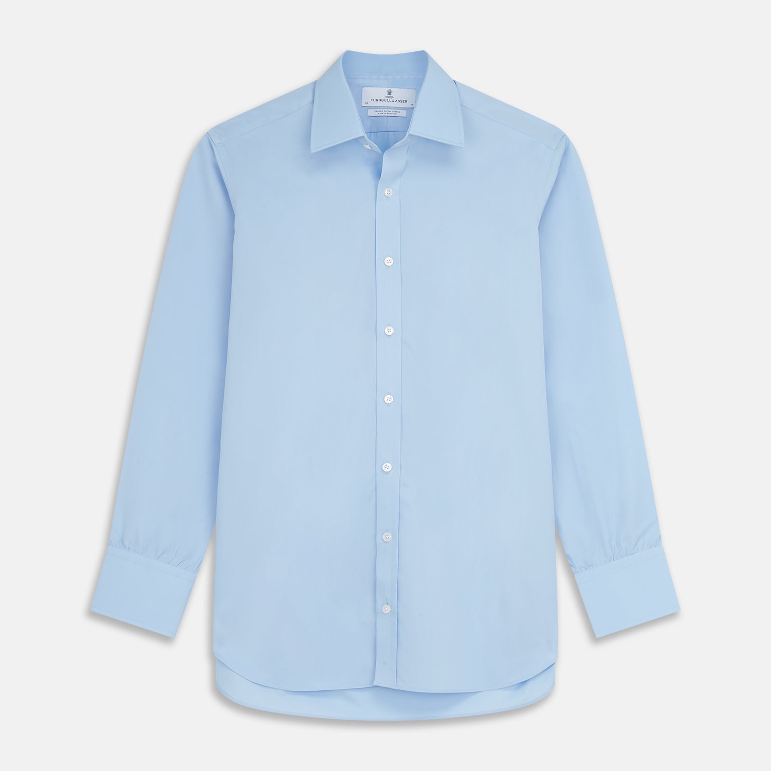View 1 of product The Turnbull & Asser Pale Blue Organic Cotton Regular Fit Mayfair Shirt features long sleeves, a pointed collar, white buttons, and buttoned cuffs, shown laid flat on a white background.