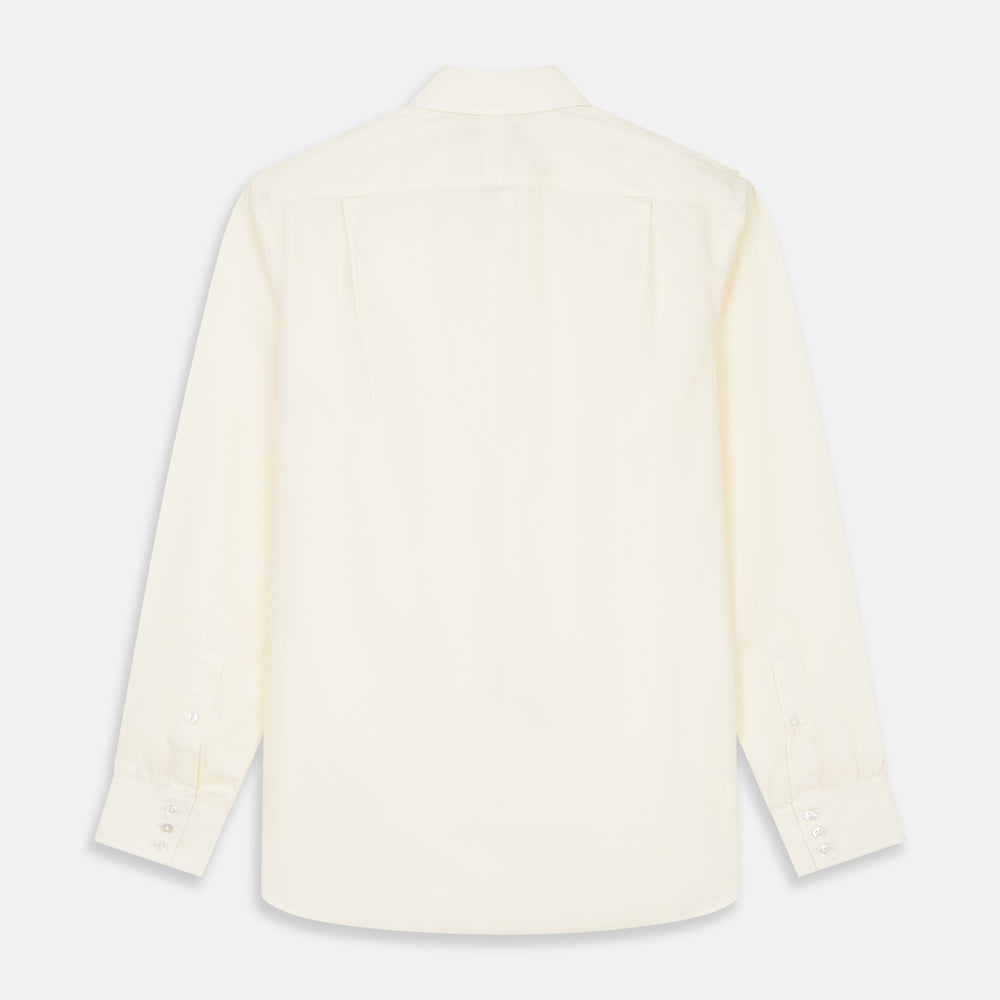 The Turnbull & Asser Tailored Fit Cream Cotton Shirt features a Kent collar and 3-button cuffs—a versatile minimalist choice, ideal on its own or paired with statement ties.