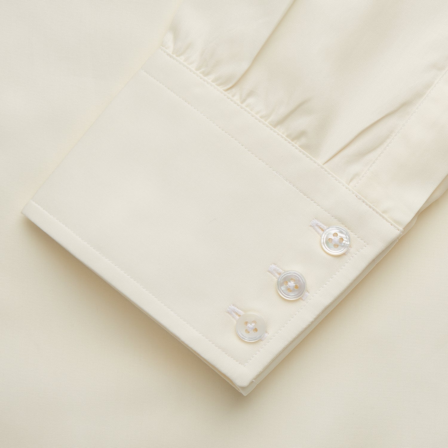 View 3 of product The Turnbull & Asser Tailored Fit Cream Cotton Shirt features a Kent collar and 3-button cuffs—a versatile minimalist choice, ideal on its own or paired with statement ties.