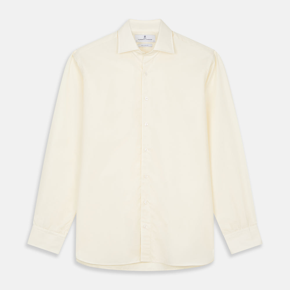 The Turnbull & Asser Tailored Fit Cream Cotton Shirt features a Kent collar and 3-button cuffs—a versatile minimalist choice, ideal on its own or paired with statement ties.