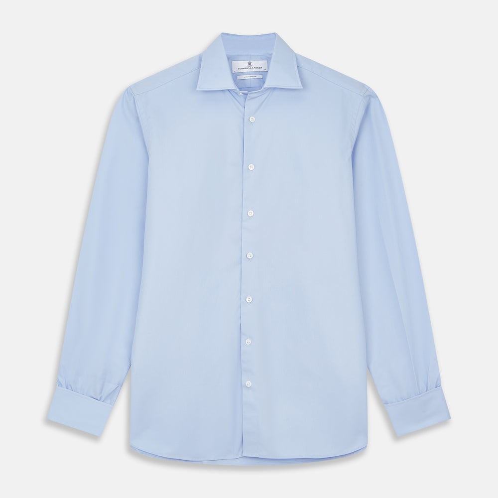 The Turnbull & Asser Tailored Fit Blue Cotton Shirt features a Kent collar and double cuffs, laid flat on a white background—ideal for pairing with a navy suit or any smart look.