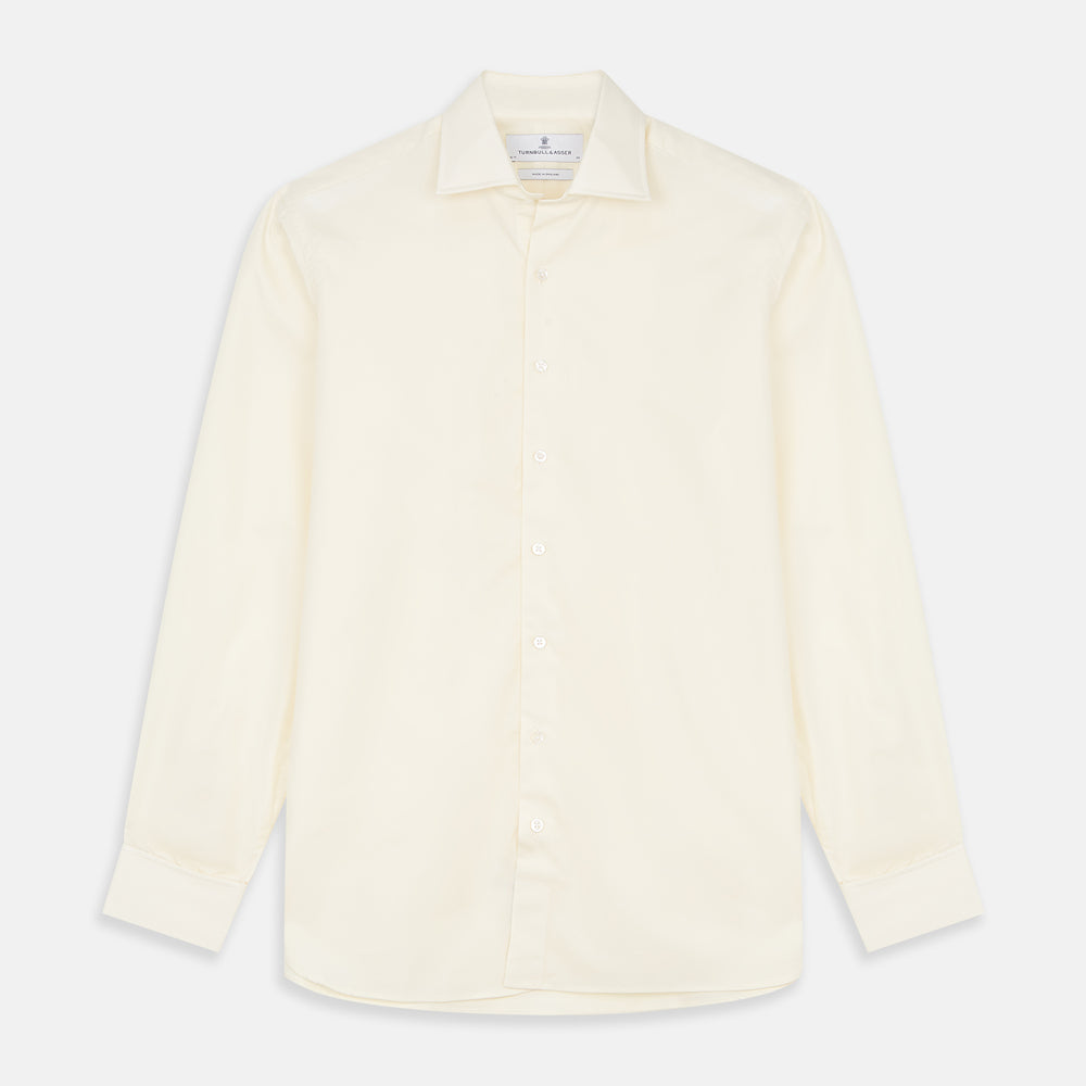 The Turnbull & Asser Tailored Fit Cream Cotton Shirt features a Kent collar and double cuffs, shown laid flat against a white background—ideal for pairing with statement ties.