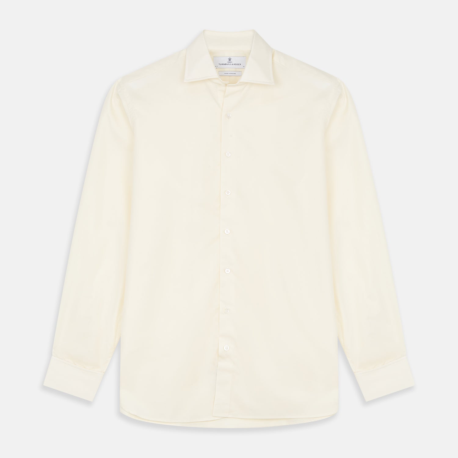 View 1 of product The Turnbull & Asser Tailored Fit Cream Cotton Shirt features a Kent collar and double cuffs, shown laid flat against a white background—ideal for pairing with statement ties.