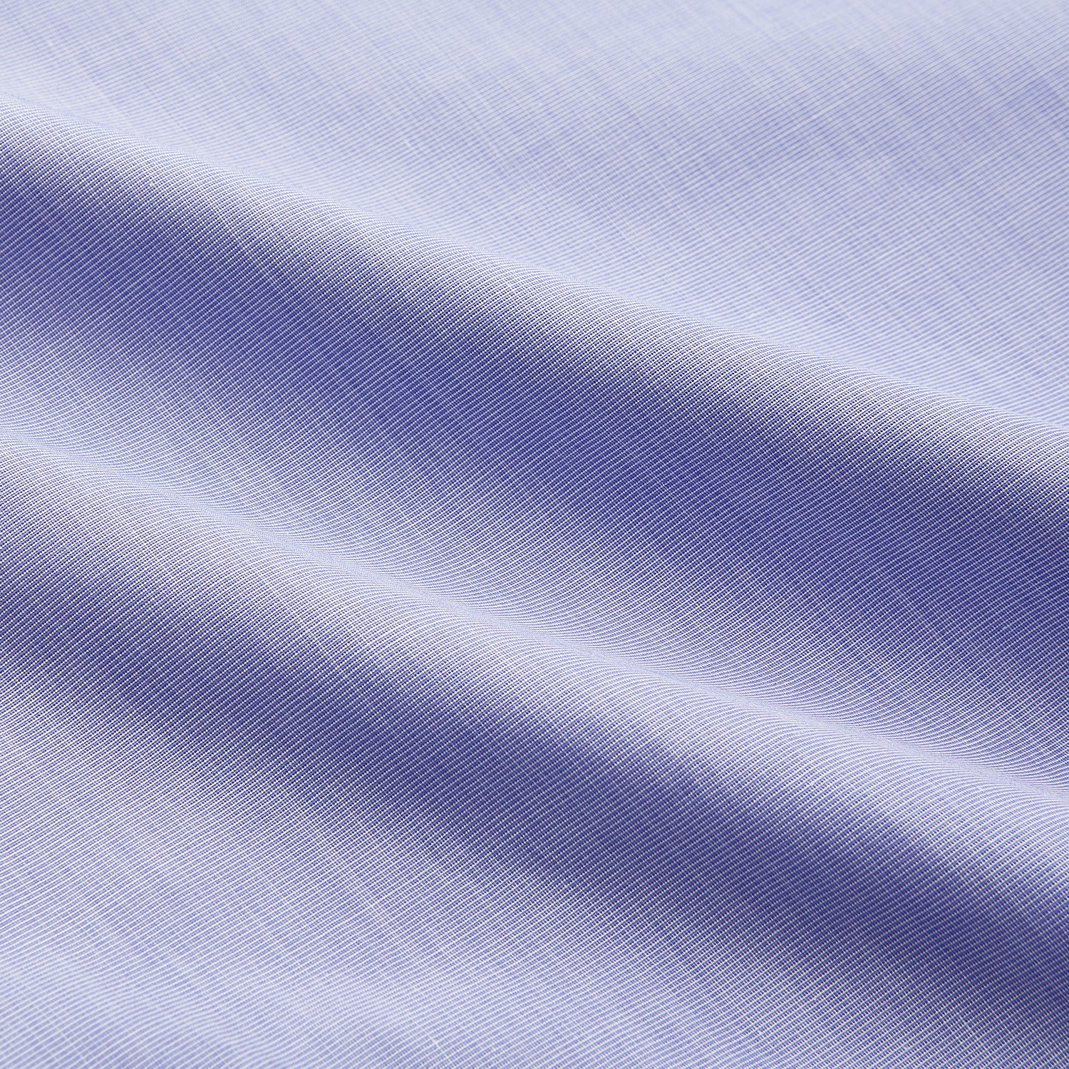 View 4 of product The Turnbull & Asser Tailored Fit Blue End-on-End Cotton Shirt features a Kent collar and double cuffs—ideal for pairing with a navy suit for a sharp look. Laid flat on a white background.