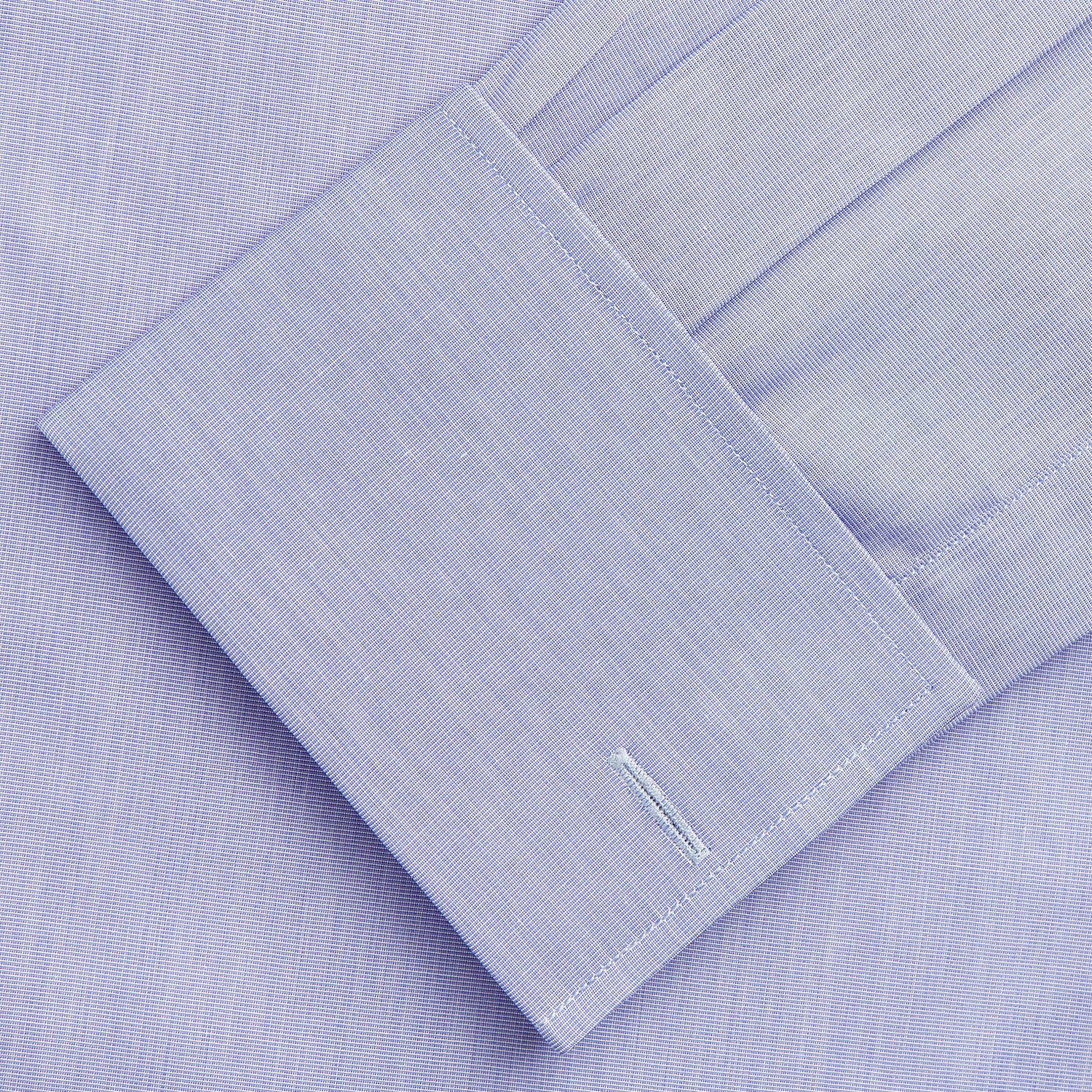 View 3 of product The Turnbull & Asser Tailored Fit Blue End-on-End Cotton Shirt features a Kent collar and double cuffs—ideal for pairing with a navy suit for a sharp look. Laid flat on a white background.