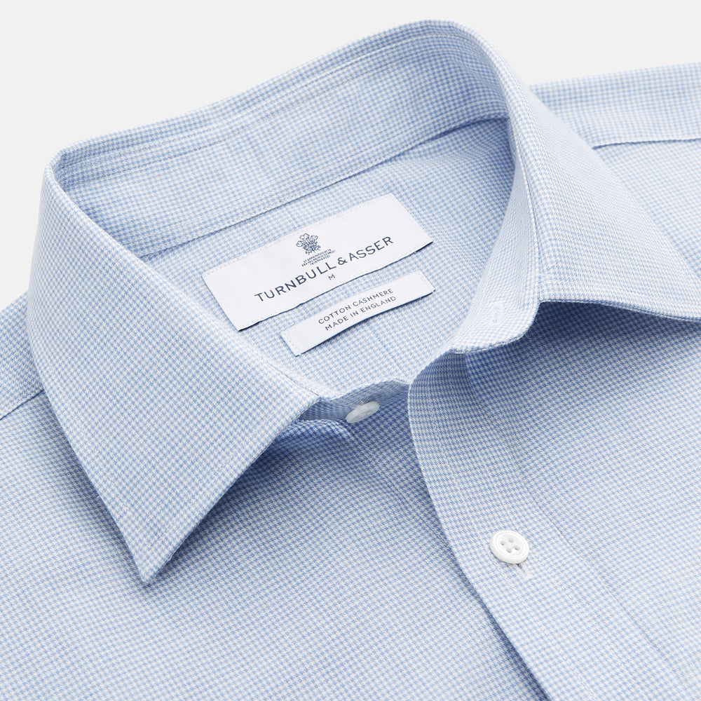 The Blue Weekend Fit Cotton-Cashmere Finch Shirt by Turnbull & Asser features a derby collar, chest pocket, and long sleeves—ideal for casual style from the Weekend Fit collection. Laid flat on white; comfortable and refined.