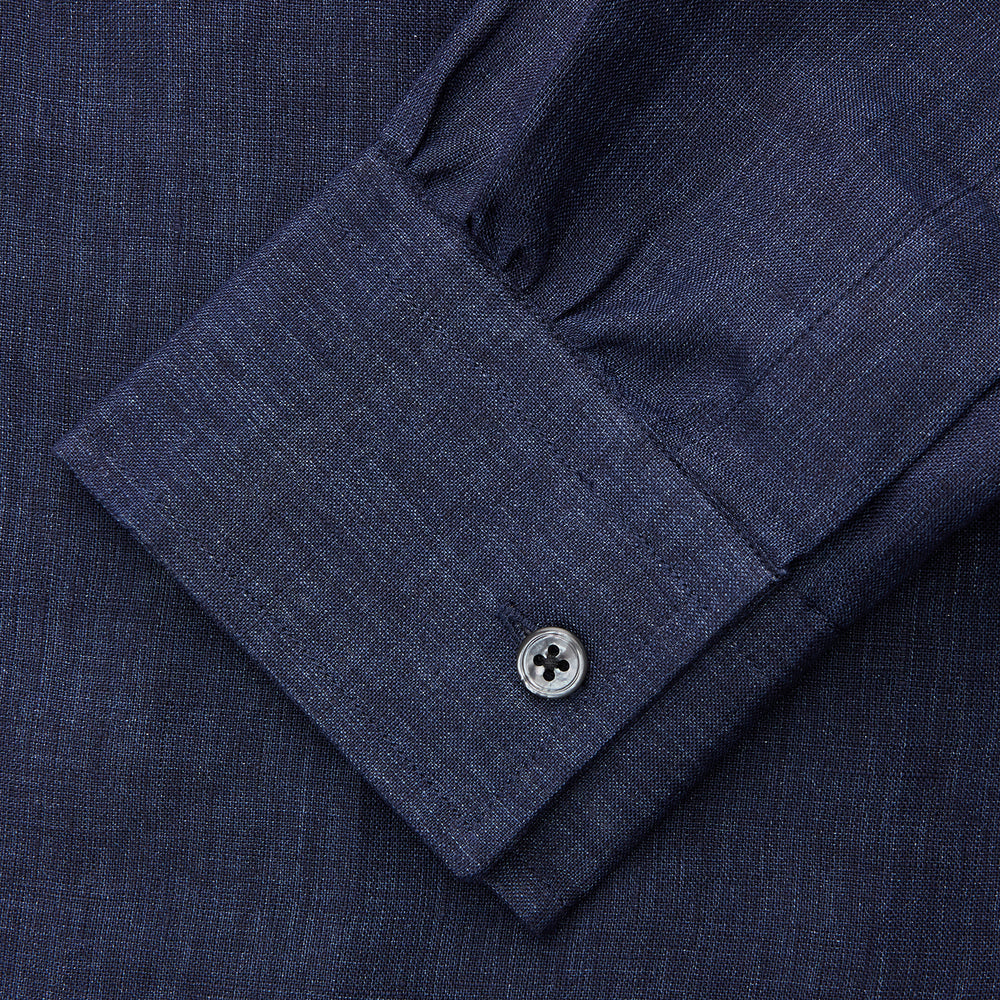 The Turnbull & Asser Navy Weekend Fit Linen Finch Shirt features a Derby collar and chest pocket, crafted from dark blue linen—ideal for casual style or adding to your weekend shirts rotation.