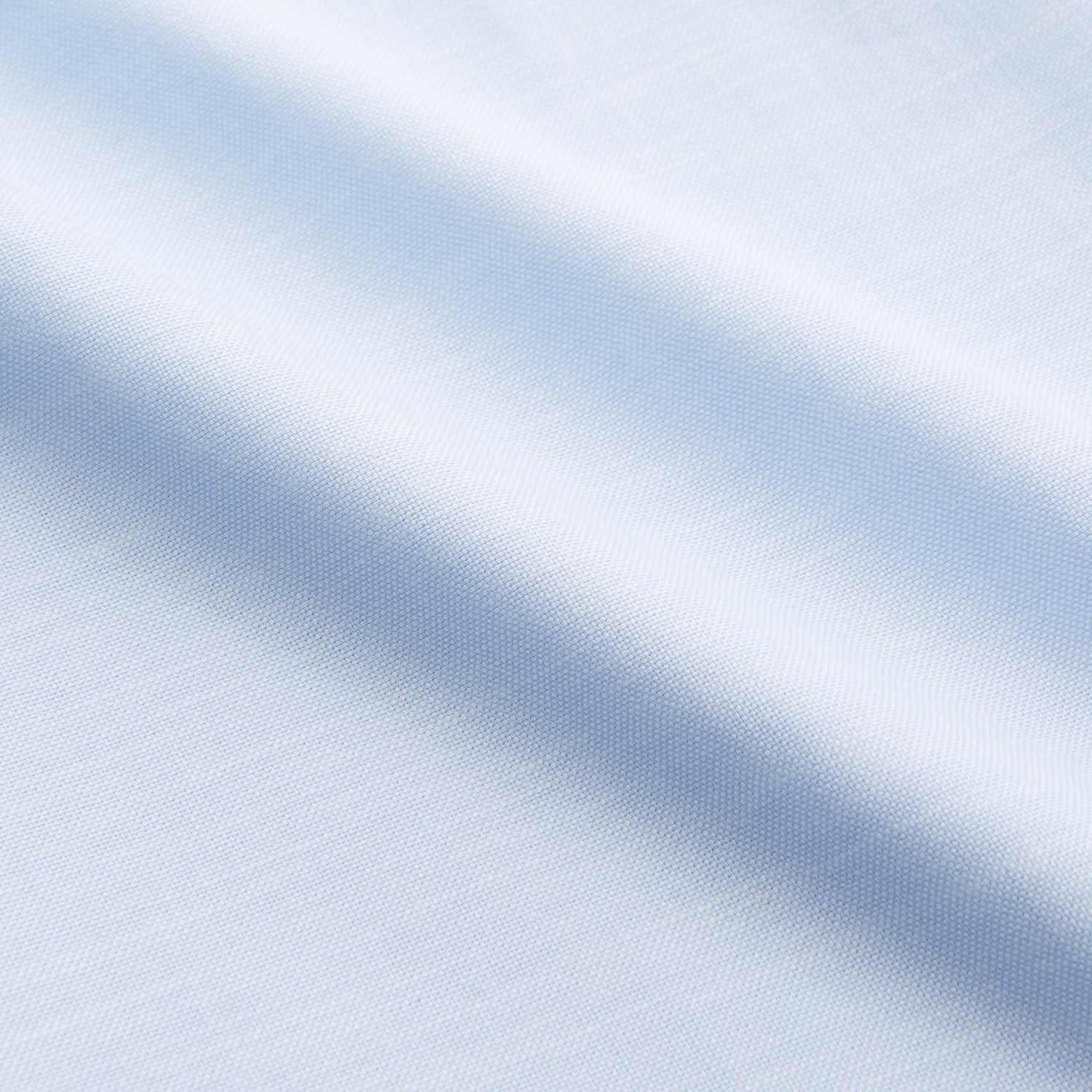 View 4 of product The Turnbull & Asser Plain Blue Weekend Fit Chambray Finch Shirt features a Derby collar, long sleeves, and a front chest pocket—shown laid flat on white—ideal for casual weekend wear.
