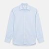 View 1 of product The Turnbull & Asser Plain Blue Weekend Fit Chambray Finch Shirt features a Derby collar, long sleeves, and a front chest pocket—shown laid flat on white—ideal for casual weekend wear.