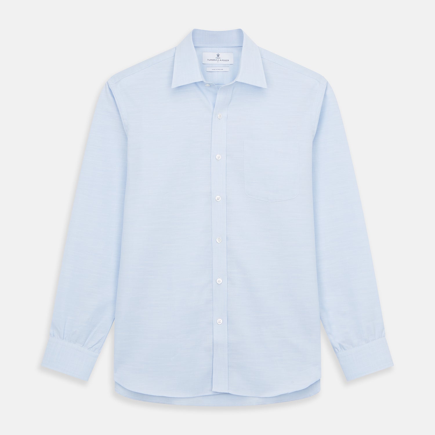 View 1 of product The Turnbull & Asser Plain Blue Weekend Fit Chambray Finch Shirt features a Derby collar, long sleeves, and a front chest pocket—shown laid flat on white—ideal for casual weekend wear.