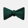 View 1 of product The Turnbull & Asser Forest Green Plain Satin Silk Bow Tie is neatly tied and displayed against a plain white background.