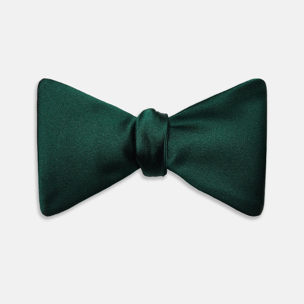 The Turnbull & Asser Forest Green Plain Satin Silk Bow Tie is neatly tied and displayed against a plain white background.