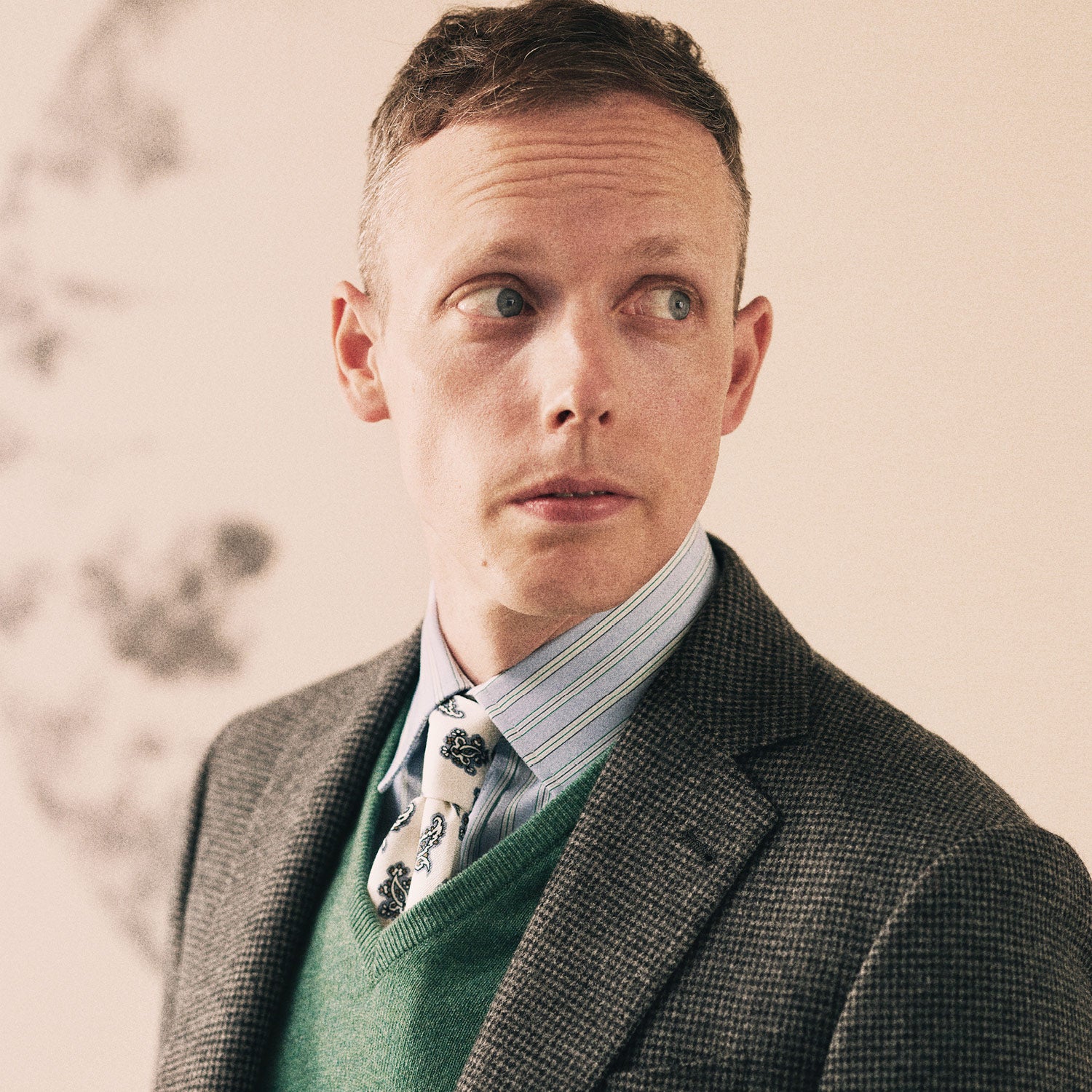 View 3 of product The Turnbull & Asser Charcoal Houndstooth Flannel Jacket features pure wool, a notched lapel, two front buttons, flap pockets, and buttoned cuffs, shown on a white background.