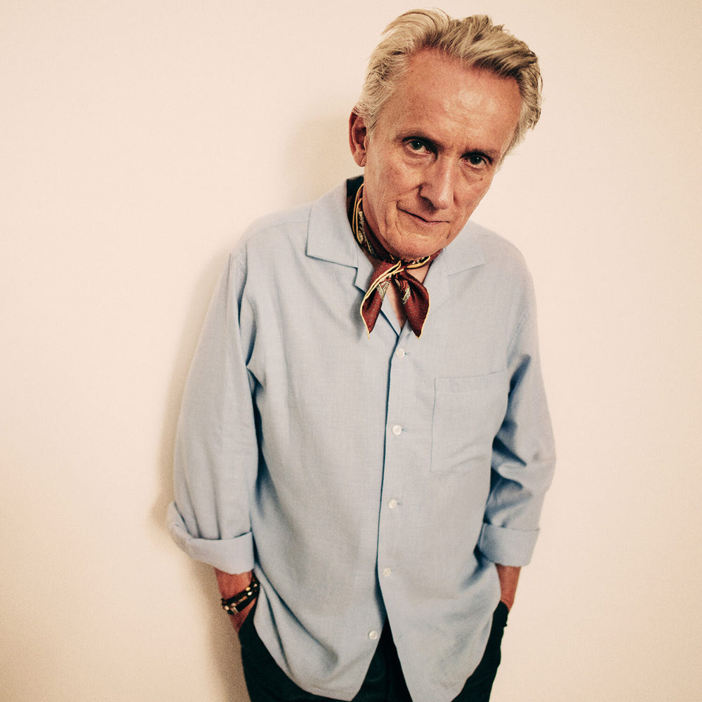 The Turnbull & Asser Holiday Fit Blue Cotton and Cashmere Blend Shirt features long sleeves, a classic collar, single chest pocket, and 1-button cuffs with white buttons, shown laid flat on a white background.