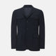The Turnbull & Asser Navy Lightweight Wool Hopsack Traveller Jacket features a notched lapel, three front buttons, and four flap pockets—two on the chest and two at the waist—all displayed on a plain white background.